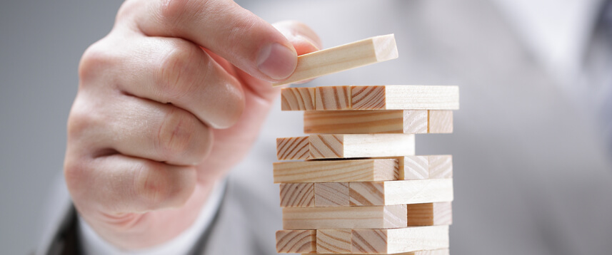 Image of a jenga tower representing business risk.