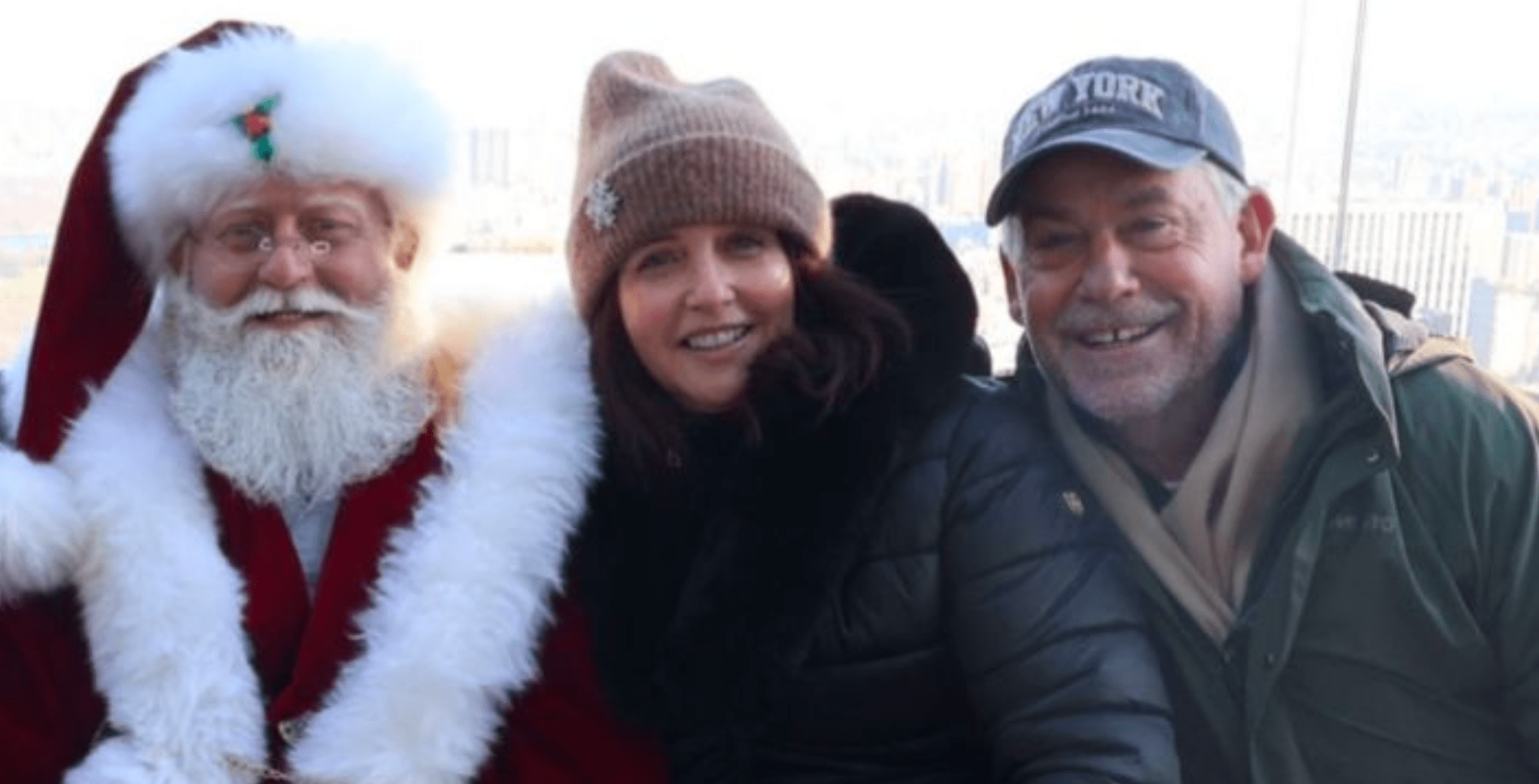 Creditserve team members with Santa